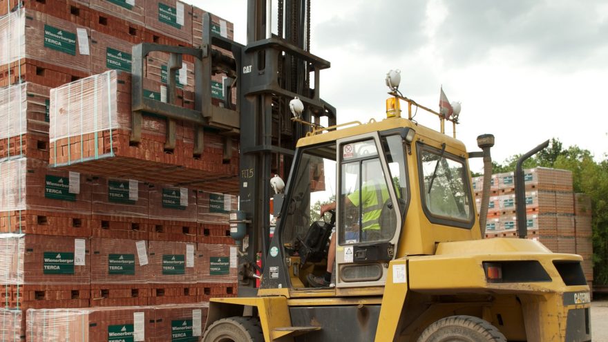 An image of a forklift transporting packaged Terca bricks.