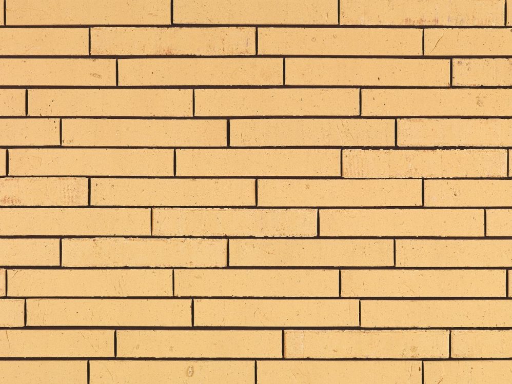 Archipolis Vegas Geel facing bricks in a soft wild bond with a glued application