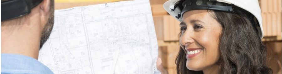 Man with pen pointing at architectural drawing