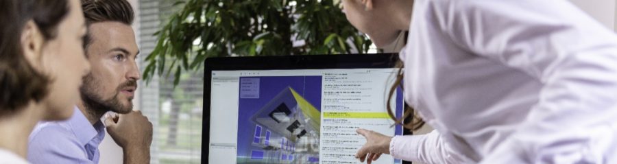 Project managers at office desk working with BIM
